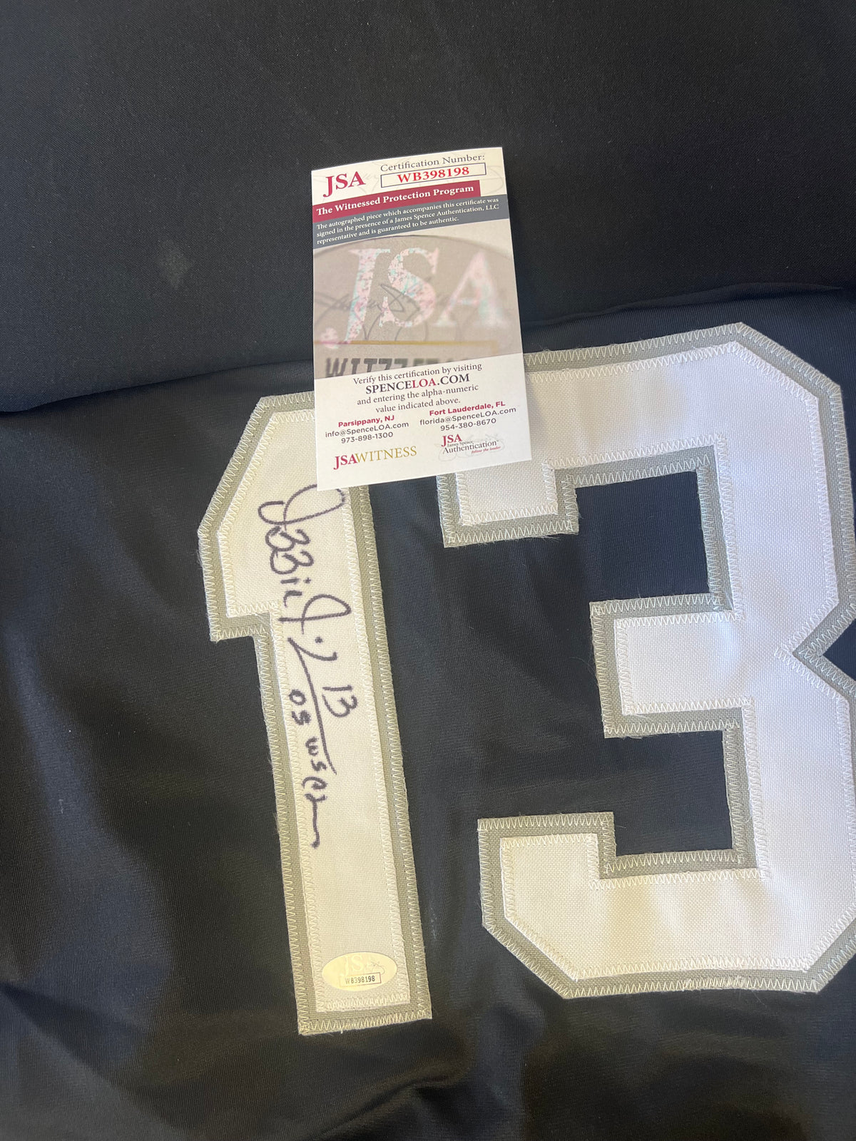 Ozzie Guillen Autographed Jersey "05 WS Champ" Black w/ JSA Cert
