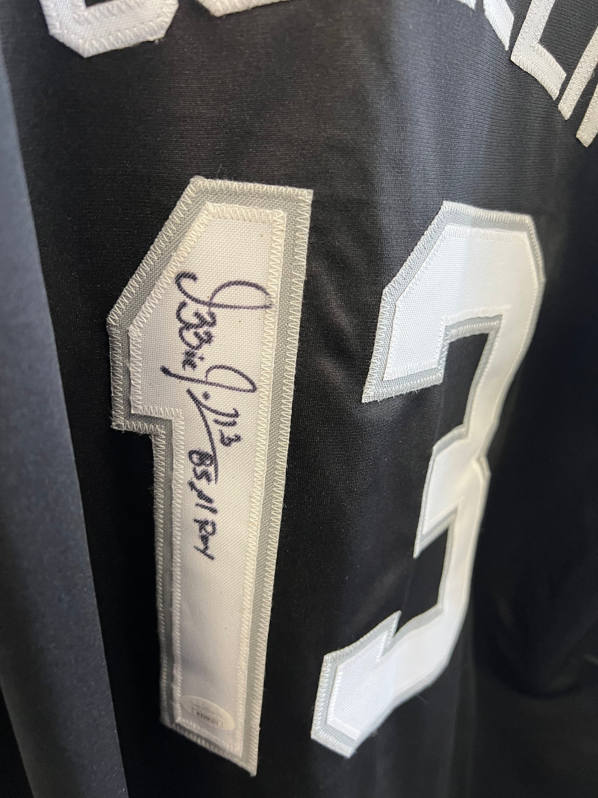 Ozzie Guillen Autographed Jersey "85 AL ROY" Black w/ JSA COA